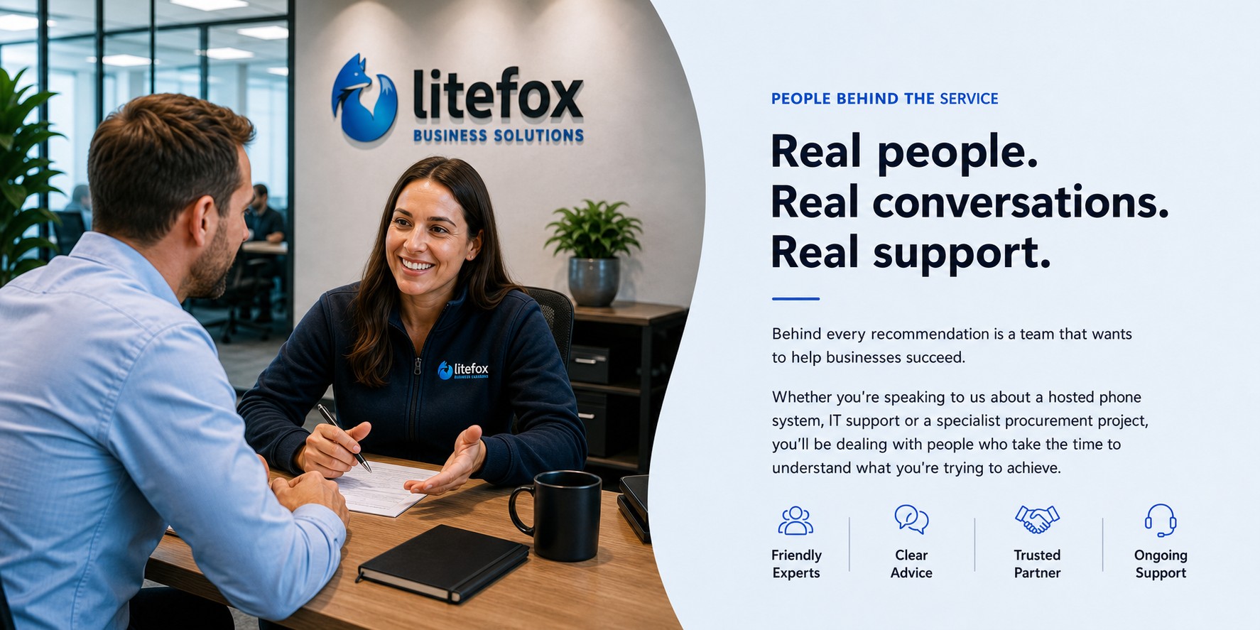 Litefox team member speaking with a customer in a modern office, with people behind the service messaging